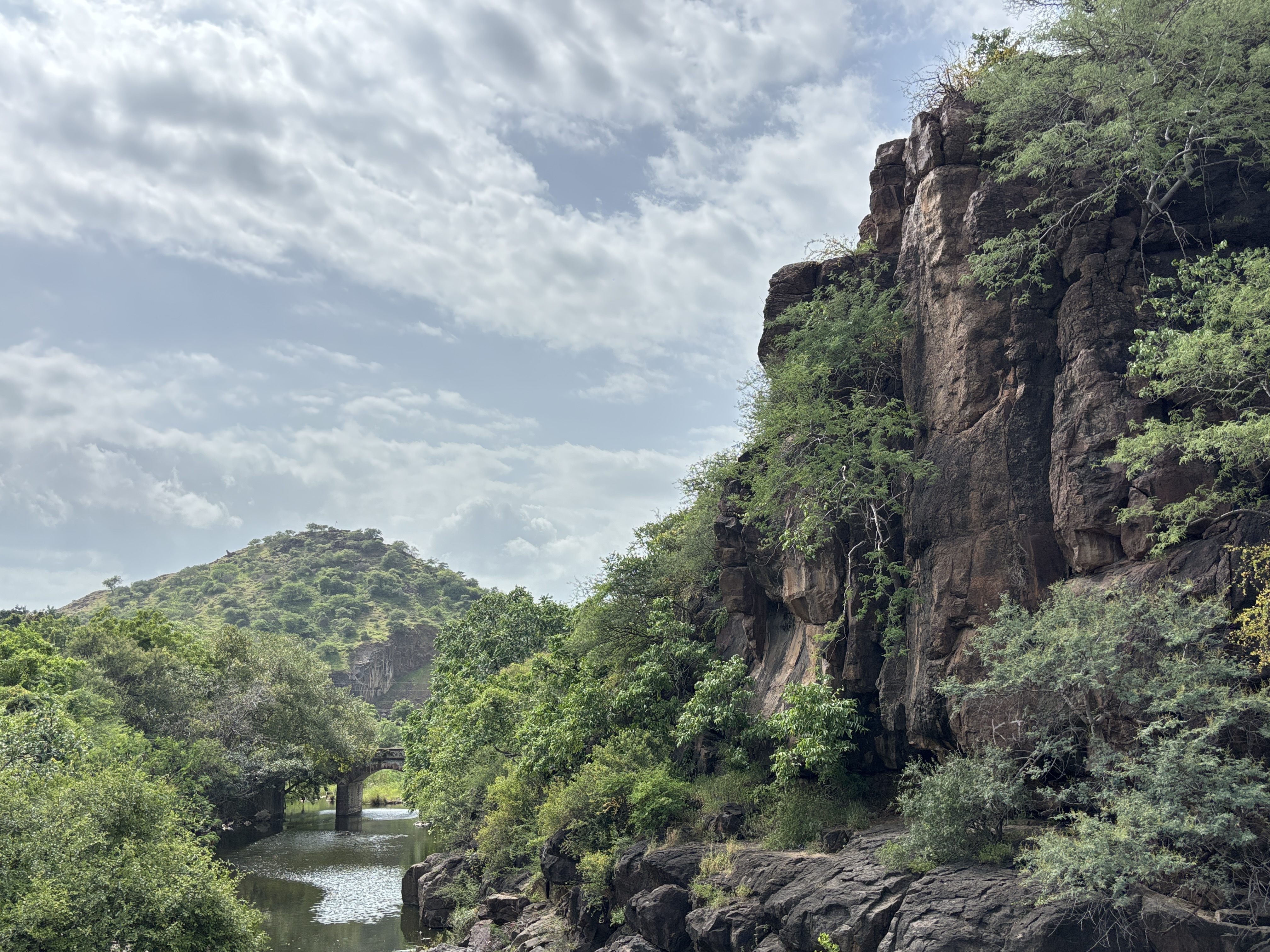 Gautami River gorge and ancient stone arch bridge in Sihor
